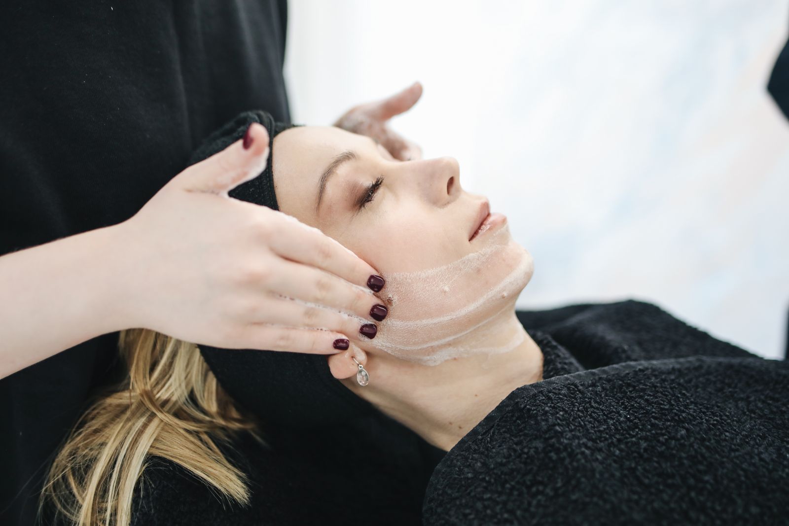 Woman receiving a facial treatment